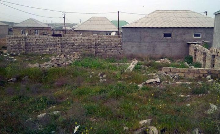 Dövlət Bakıda avtomobil yolunun altına düşən torpaq sahələrini alacaq